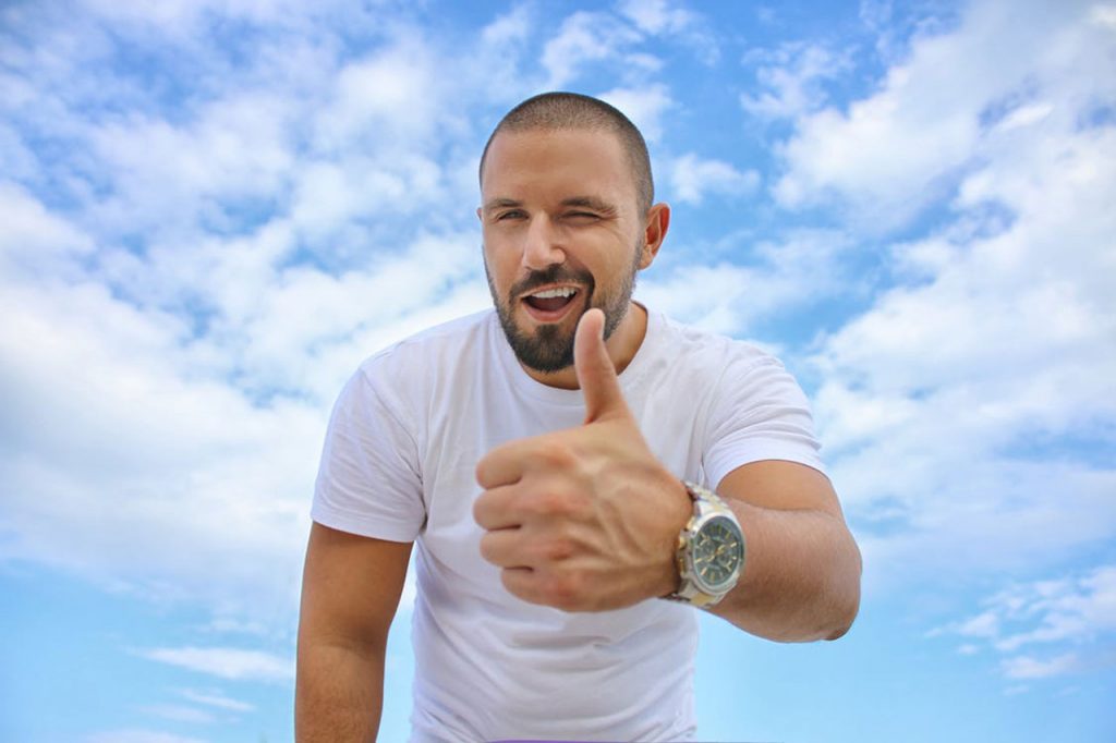 men_health_thumbs_up_blue_sky